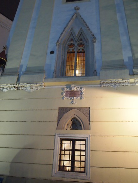 There's a cannonball from one of Napoleon's sieges to the left of the window