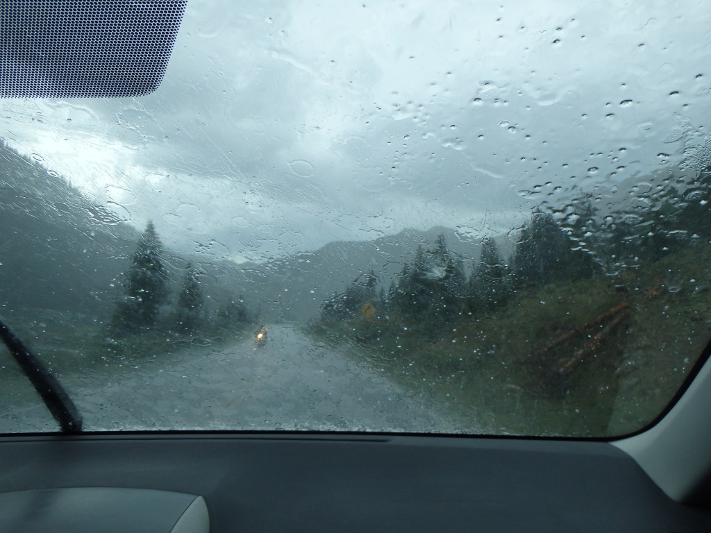 Driving down a steep grade in the rain and hail 