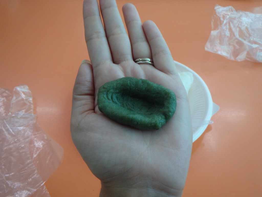 Take a piece of dough and roll it into a ball, then make a well with your thumb