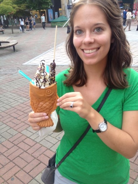Soft serve in a fish cone with chocolate-covered grapes and sprinkles