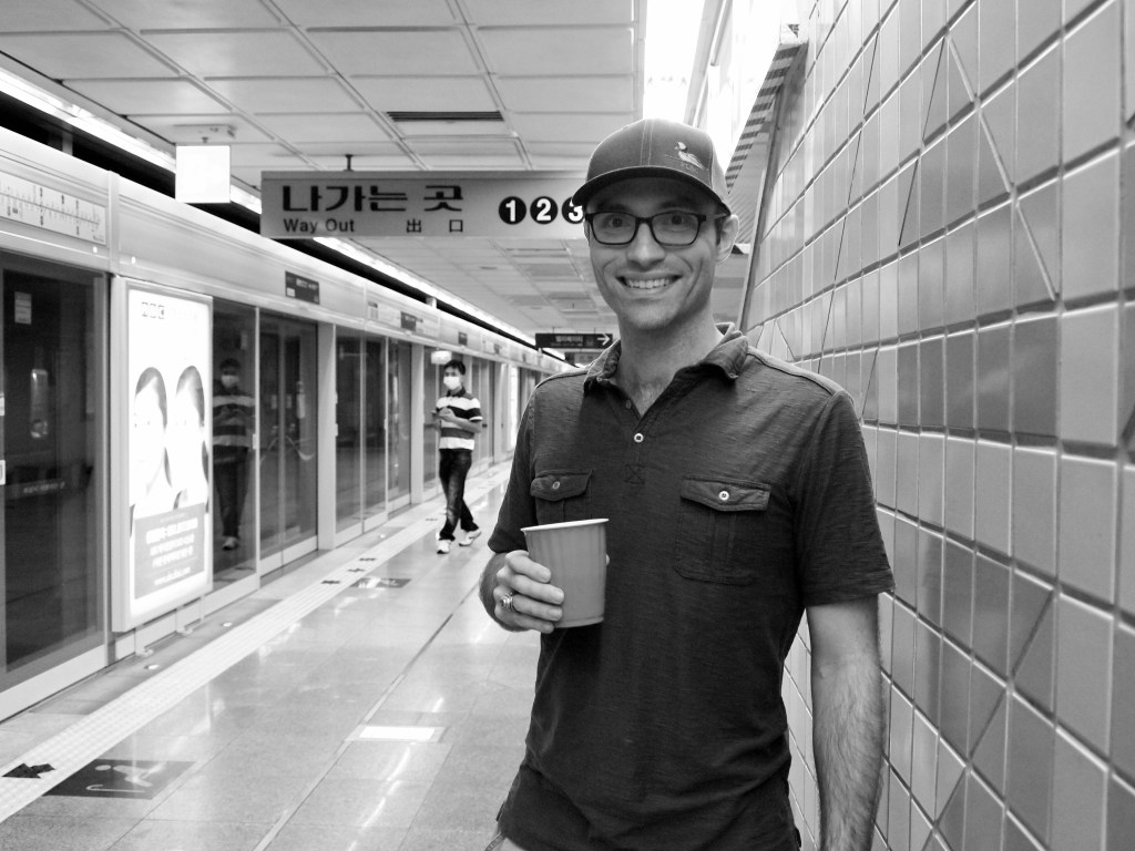 Zach drinking a double IPA from Galmegi in the subway...