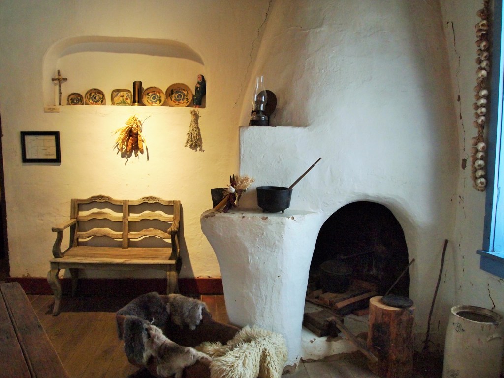 The kitchen had a large kiva fireplace/stove