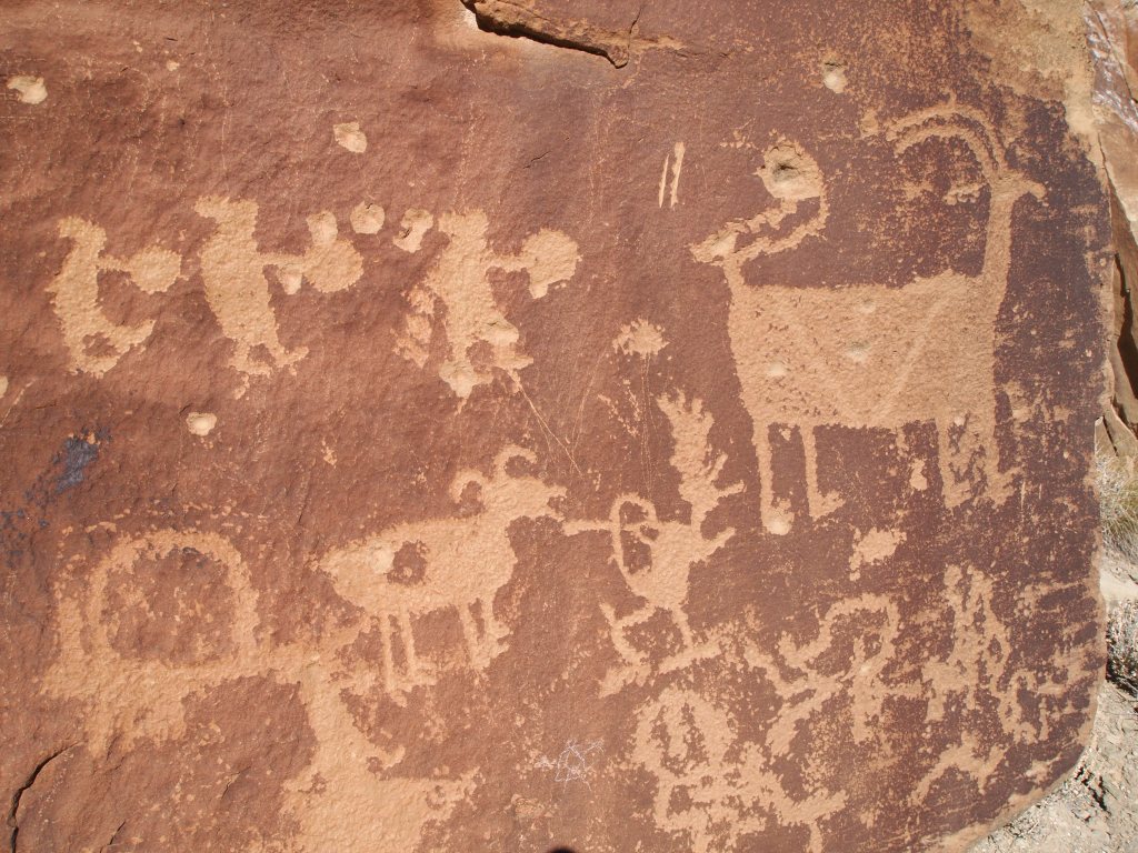 Hunters chasing a bighorn sheep